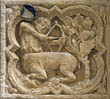 Panel 16:04 - Centaur with bow and arrow, shooting at parrot in a tree